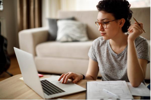 young woman working at home on laptop