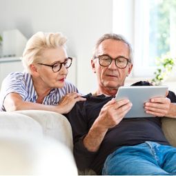 senior-couple-watching-digital-tablet-together-at-home-picture-id1219364296 (1).jpg